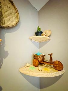 a shelf with a basket and a bike on a wall at DMCeara Golden Fortaleza - Praia in Fortaleza