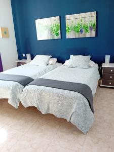 Postel nebo postele na pokoji v ubytování Villas Reina