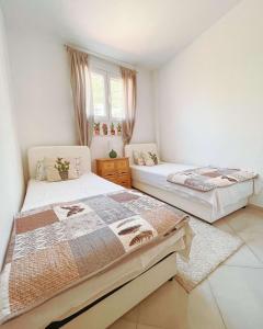 Postel nebo postele na pokoji v ubytování Al Mare Vacation Home