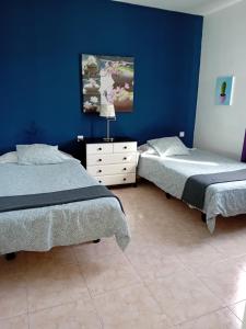 Postel nebo postele na pokoji v ubytování Villas Reina