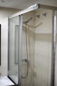 a shower with a glass door in a bathroom at Benal Beach Apartment in Benalmádena