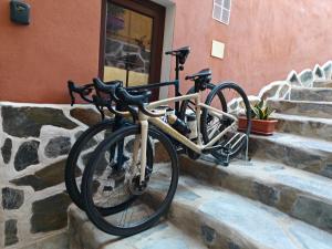 a bike parked on some steps next to a building at El Pequeño Refugio - C in Chío