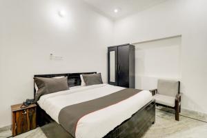 Postel nebo postele na pokoji v ubytování Hotel O BJ Residency + 33 fotografií