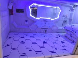 Postel nebo postele na pokoji v ubytování Xi'an Xianyang International Airport Space Capsule Hotel + 9 fotografií