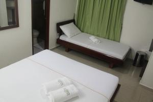 Postel nebo postele na pokoji v ubytování Hotel Preferencial Class
