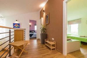a living room with a bed and a table at Holiday home in Jakovici - Istrien 53392 in Bašići