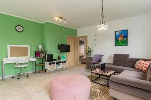 a living room with a couch and a table at Holiday home in Jakovici - Istrien 53392 in Bašići
