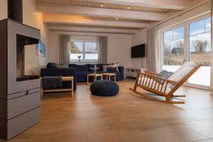 a living room with a couch and a chair in it at Holiday home in Altwarp 50009 in Altwarp