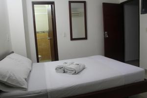 Postel nebo postele na pokoji v ubytování Hotel Preferencial Class