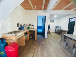 a kitchen with a stove and a counter top at Casa Cruz Melgar in Melgar