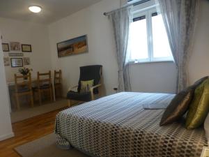 Postel nebo postele na pokoji v ubytování Apartment Emily