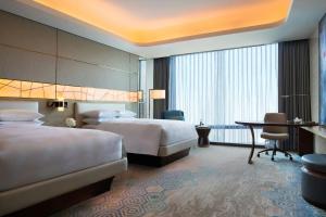 Voodi või voodid majutusasutuse JW Marriott Hotel Macau toas