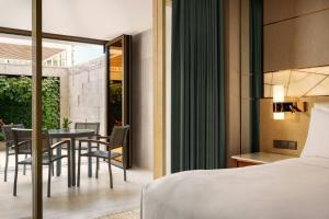 Voodi või voodid majutusasutuse JW Marriott Hotel Macau toas