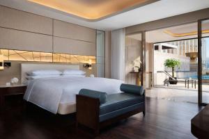Voodi või voodid majutusasutuse JW Marriott Hotel Macau toas