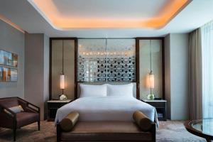 Voodi või voodid majutusasutuse JW Marriott Hotel Macau toas