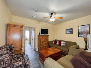 a living room with a couch and a tv at 1BR 1BA for 5 Close to Outdoor Activities in Brian Head