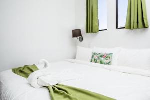 Cama o camas de una habitación en The Palms At Coco Beach