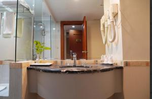 Vannituba majutusasutuses Abadi Suite Hotel & Tower