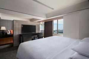 Postel nebo postele na pokoji v ubytování Sheraton Taitung Hotel