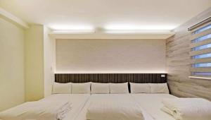 Postel nebo postele na pokoji v ubytování Huaxin Hotel