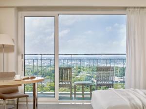 Voodi või voodid majutusasutuse Haevichi Hotel & Resort Jeju toas