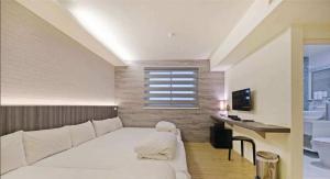 Postel nebo postele na pokoji v ubytování Huaxin Hotel