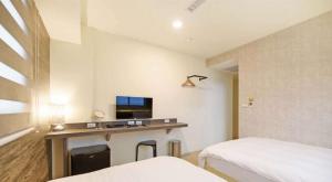 Postel nebo postele na pokoji v ubytování Huaxin Hotel