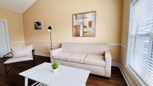 a living room with a couch and a table at Adorable 1BR condo with pool view at Magnolia in Myrtle Beach
