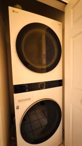 a microwave oven sitting next to a door at Adorable 1BR condo with pool view at Magnolia in Myrtle Beach