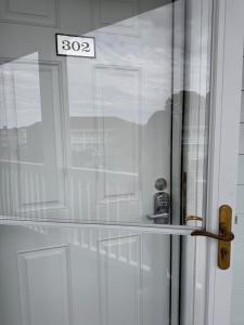 a white door with a sign that reads at Adorable 1BR condo with pool view at Magnolia in Myrtle Beach
