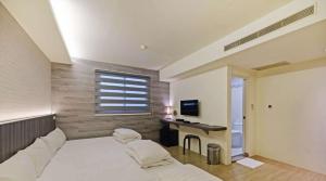 TV a/nebo společenská místnost v ubytování Huaxin Hotel