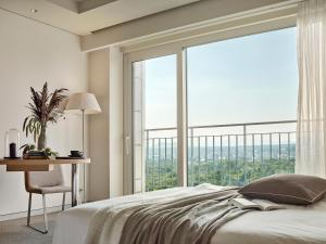 Voodi või voodid majutusasutuse Haevichi Hotel & Resort Jeju toas