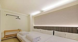 Postel nebo postele na pokoji v ubytování Huaxin Hotel