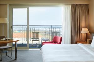 Voodi või voodid majutusasutuse Haevichi Hotel & Resort Jeju toas