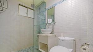 Koupelna v ubytování Huaxin Hotel