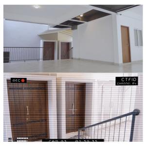 a building with two garage doors in a room at Diyawanna Villa - Deluxe Twin Room in Colombo in Sri Jayewardenepura Kotte