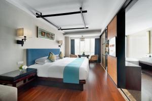 Postel nebo postele na pokoji v ubytování SSAW Boutique Hotel Hefei Intime Centre