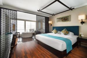 Postel nebo postele na pokoji v ubytování SSAW Boutique Hotel Hefei Intime Centre