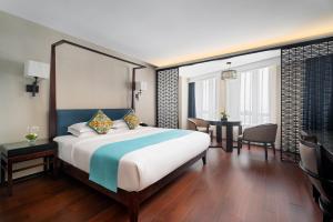 Postel nebo postele na pokoji v ubytování SSAW Boutique Hotel Hefei Intime Centre