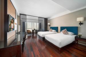 Postel nebo postele na pokoji v ubytování SSAW Boutique Hotel Hefei Intime Centre