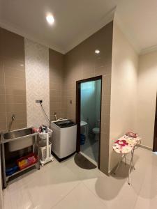 a bathroom with a sink and a toilet at D'Kiara Villa in Kangar