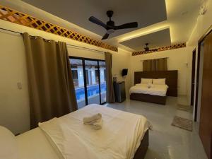Postel nebo postele na pokoji v ubytování Lulinghayaw Resort-Panglao