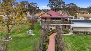 an aerial view of a house with a red roof at Crows Nest Tourist Park in Crows Nest