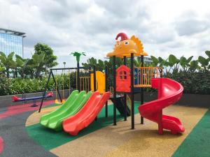 a playground with a slide at Cozy and Nice Studio at Sayana Bekasi Apartment By Travelio in Bekasi