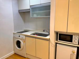 a kitchen with a sink and a washing machine at Studio 6 in Seoul +20 photos