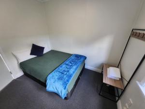 Postel nebo postele na pokoji v ubytování LKNZ Lodge & Cafe