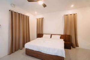 Postel nebo postele na pokoji v ubytování Lulinghayaw Resort-Panglao
