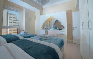 Postel nebo postele na pokoji v ubytování ROYAL BEACH RESIDENCES 2