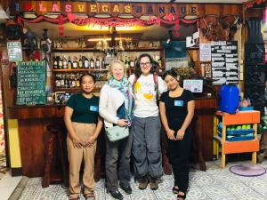 a group of people standing in front of a bar at Las vegas lodge and restaurant in Banaue