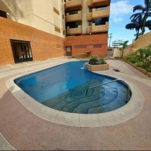 Πισίνα στο ή κοντά στο Oasis Beach Apartment, Beachfront
